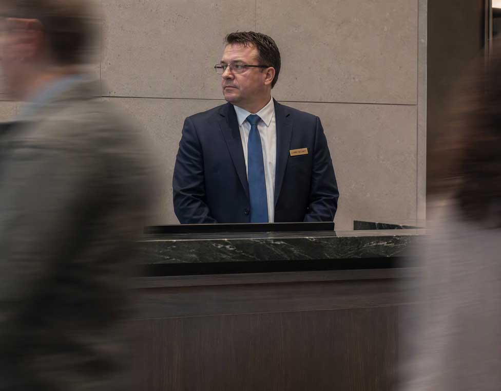 CITIPRO concierge security officer monitoring a front desk