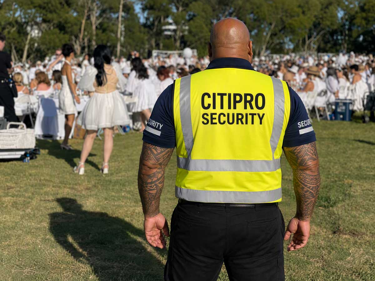 CITIPRO security officer standing guard at a large gathering